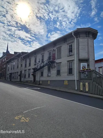 a front view of a house with balcony