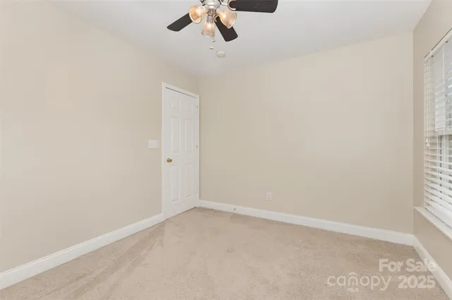 an empty room with a empty space and a window