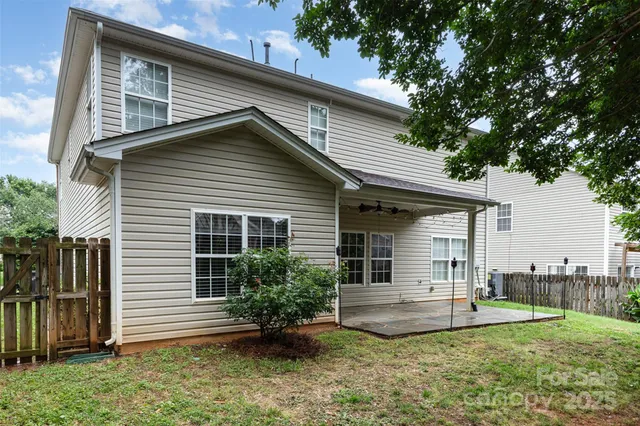 a view of a house with a yard and plants