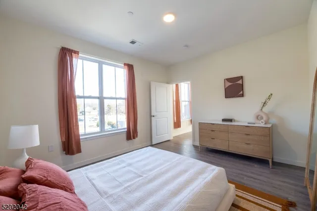 a bed room with a bed and a window