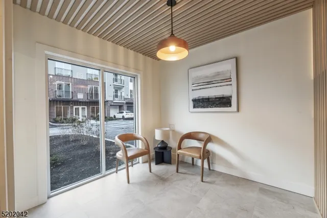 a view of a livingroom with furniture and window