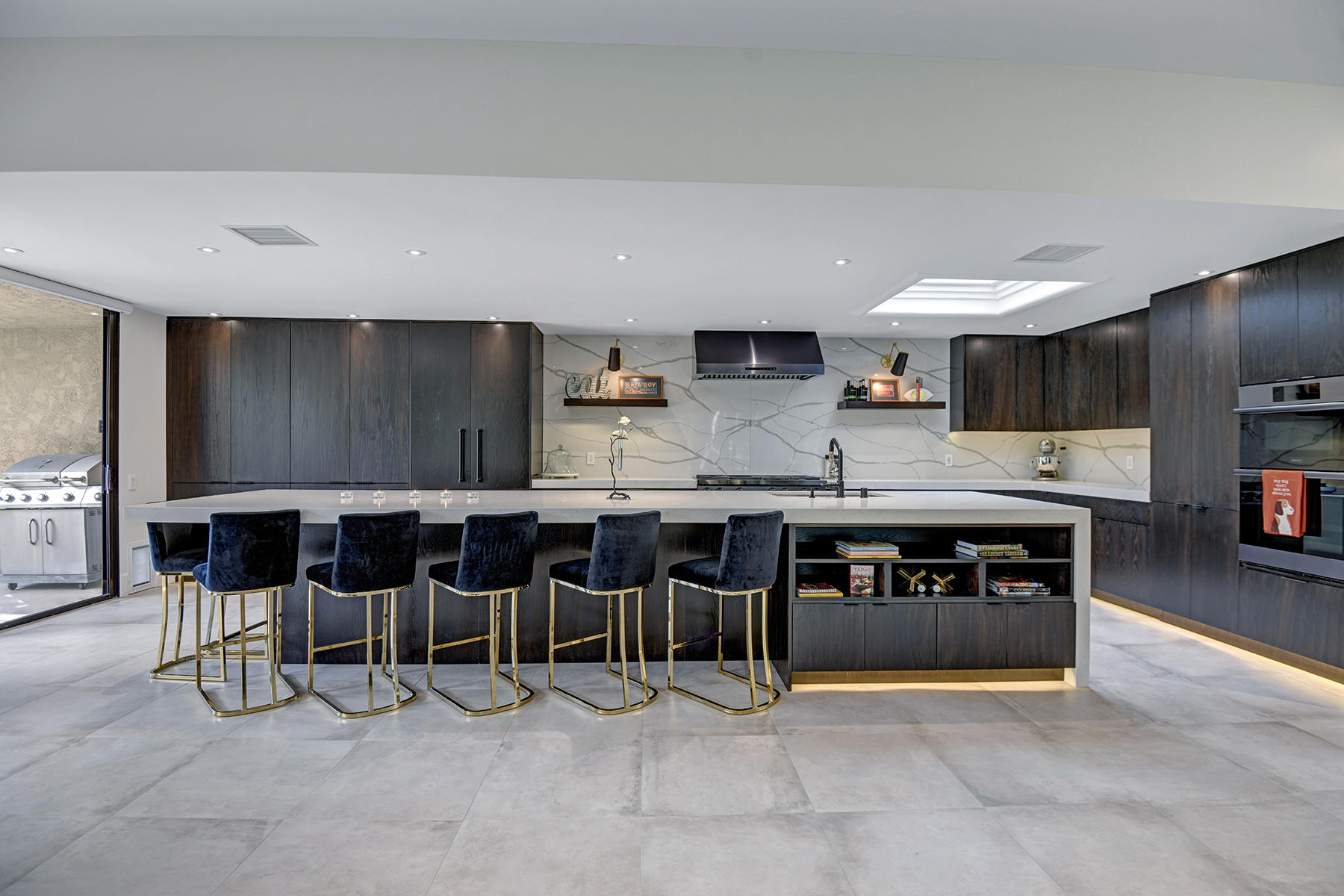 13 Rutgers Court Rancho Mirage, CA 92270 - Photo 14 of 42 a large kitchen with cabinets chairs and a sink