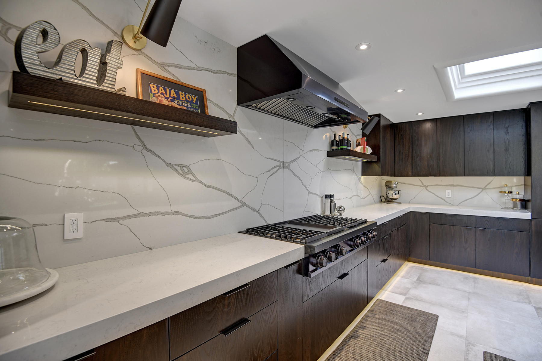 13 Rutgers Court Rancho Mirage, CA 92270 - Photo 16 of 42 a kitchen with granite countertop a stove and a sink