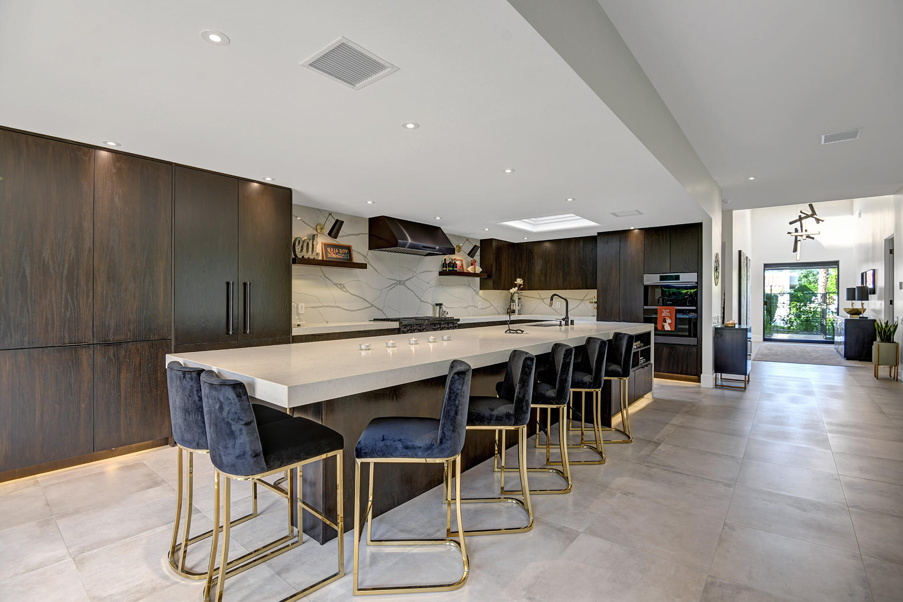 13 Rutgers Court Rancho Mirage, CA 92270 - Photo 17 of 42 a kitchen with stainless steel appliances kitchen island granite countertop a dining table chairs and granite counter tops