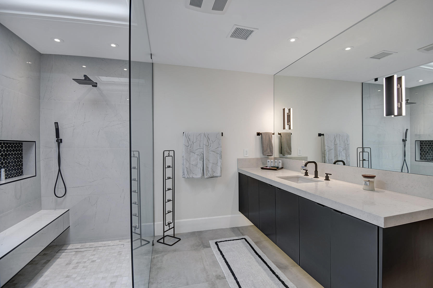 13 Rutgers Court Rancho Mirage, CA 92270 - Photo 24 of 42 a en suite bathroom with a double vanity sink a mirror and a shower