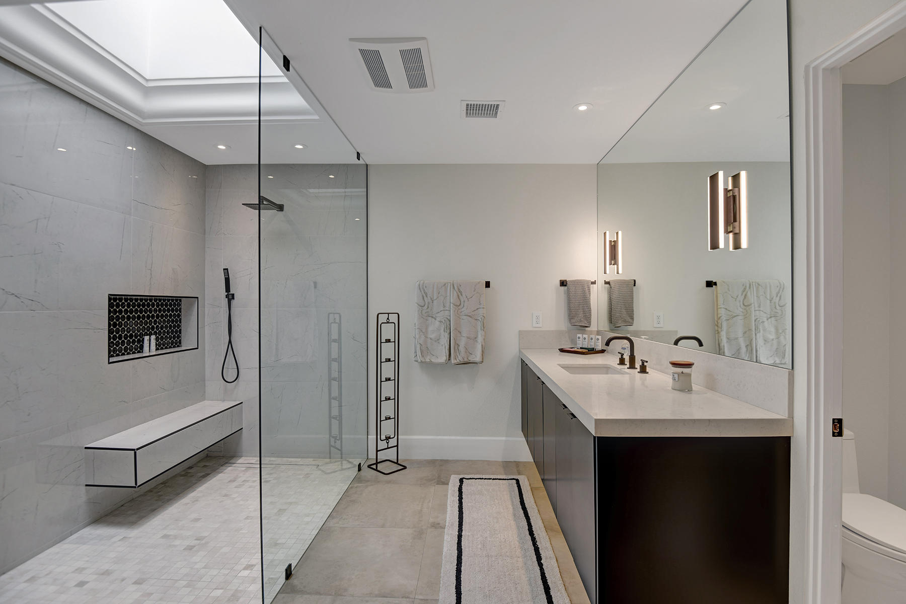 13 Rutgers Court Rancho Mirage, CA 92270 - Photo 25 of 42 a bathroom with a double vanity sink a and mirror