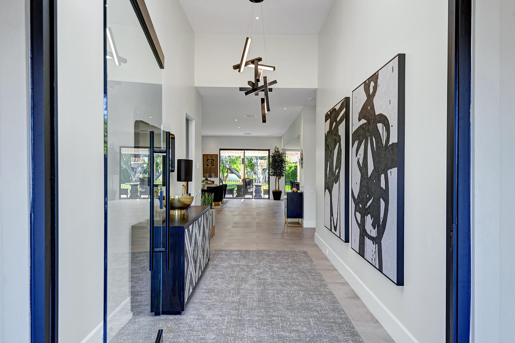 13 Rutgers Court Rancho Mirage, CA 92270 - Photo 4 of 42 a view of a hallway to a livingroom and a couch