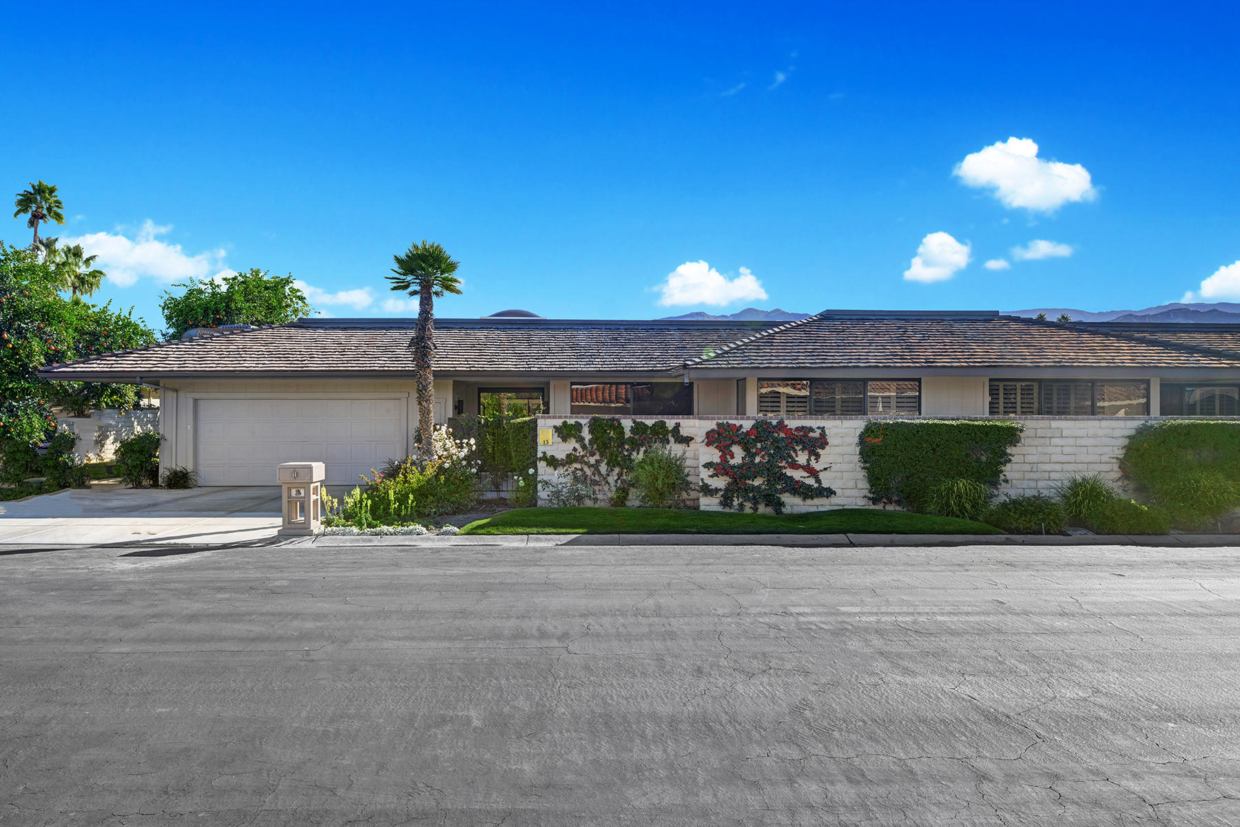 13 Rutgers Court Rancho Mirage, CA 92270 - Photo 34 of 42 front view of a house with a yard