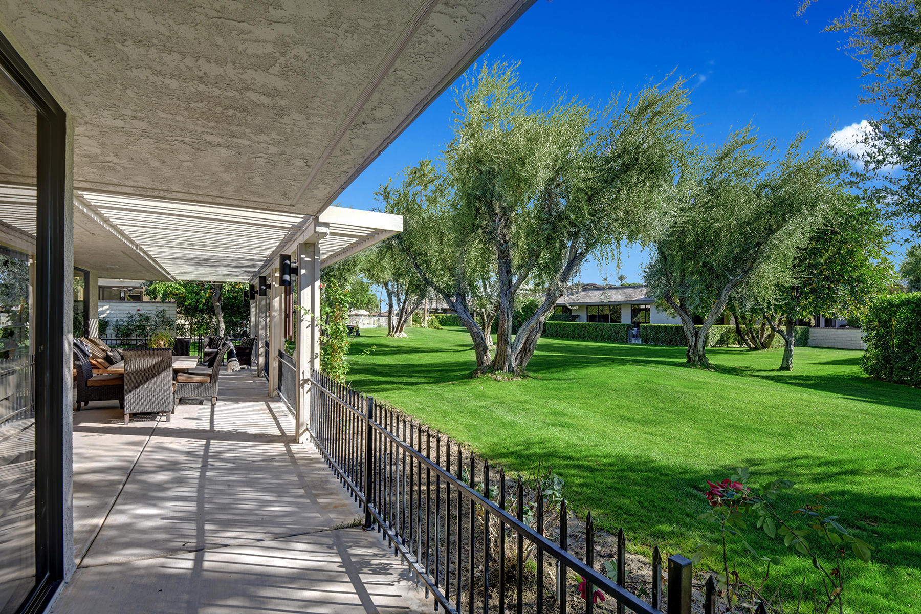 13 Rutgers Court Rancho Mirage, CA 92270 - Photo 37 of 42 a view of a house with backyard and a patio