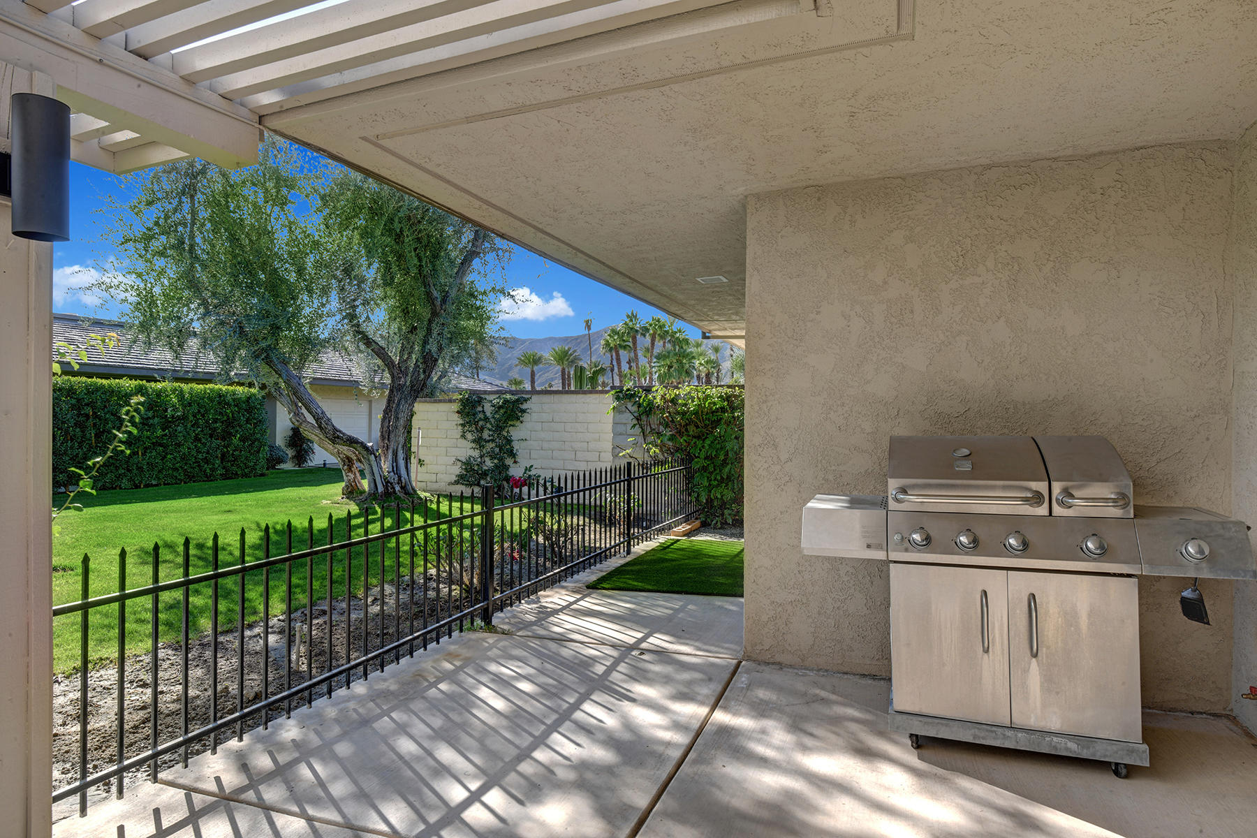 13 Rutgers Court Rancho Mirage, CA 92270 - Photo 38 of 42 a view of a porch with furniture and garden
