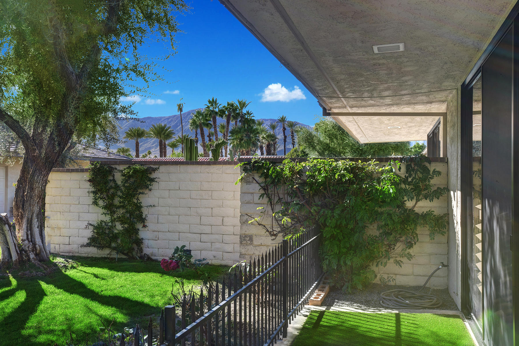 13 Rutgers Court Rancho Mirage, CA 92270 - Photo 39 of 42 a backyard of a house with lots of green space