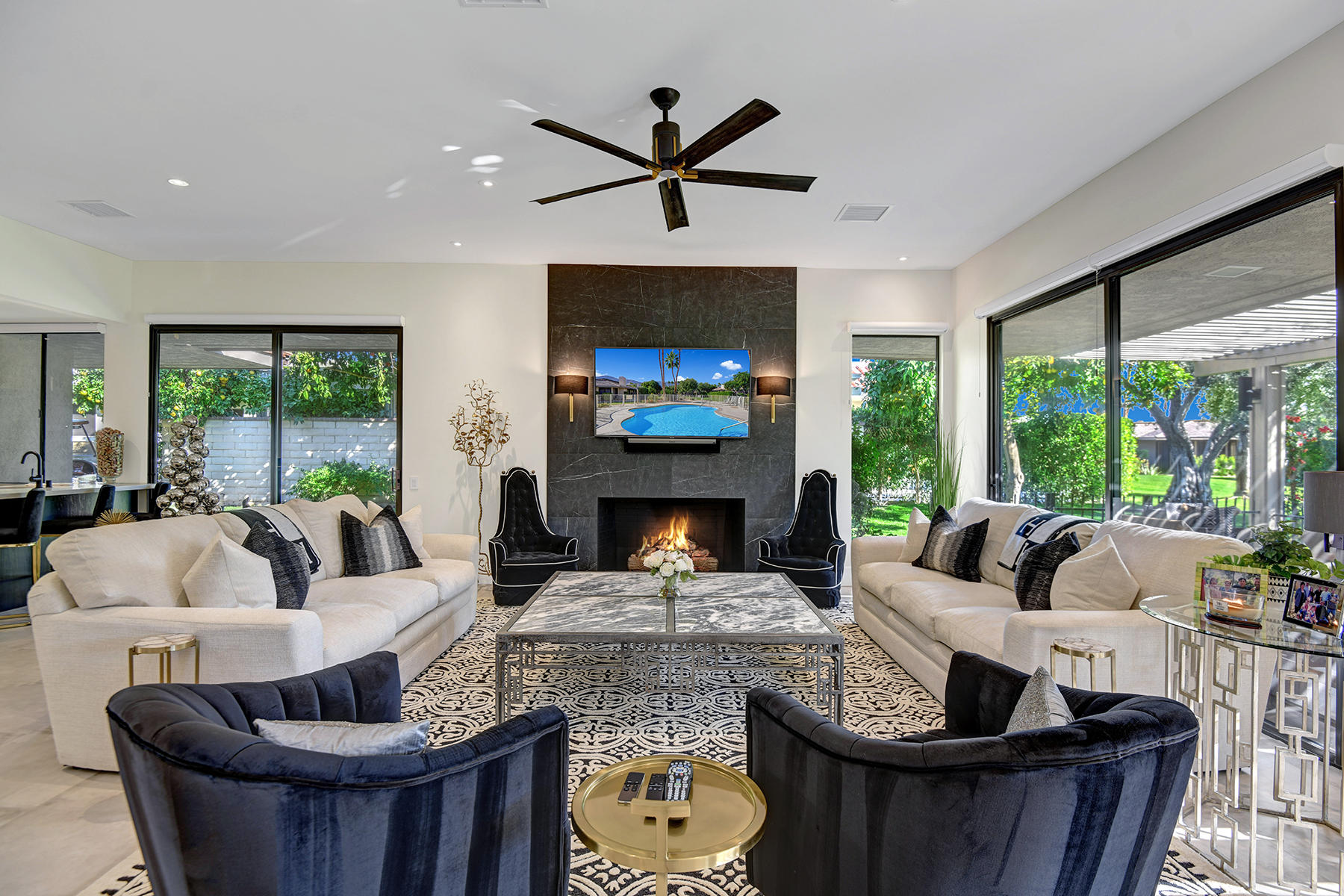 13 Rutgers Court Rancho Mirage, CA 92270 - Photo 10 of 42 a living room with fireplace furniture and a large window