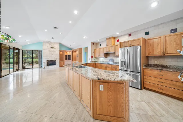 a view of an entryway with floor to ceiling window and an empty room