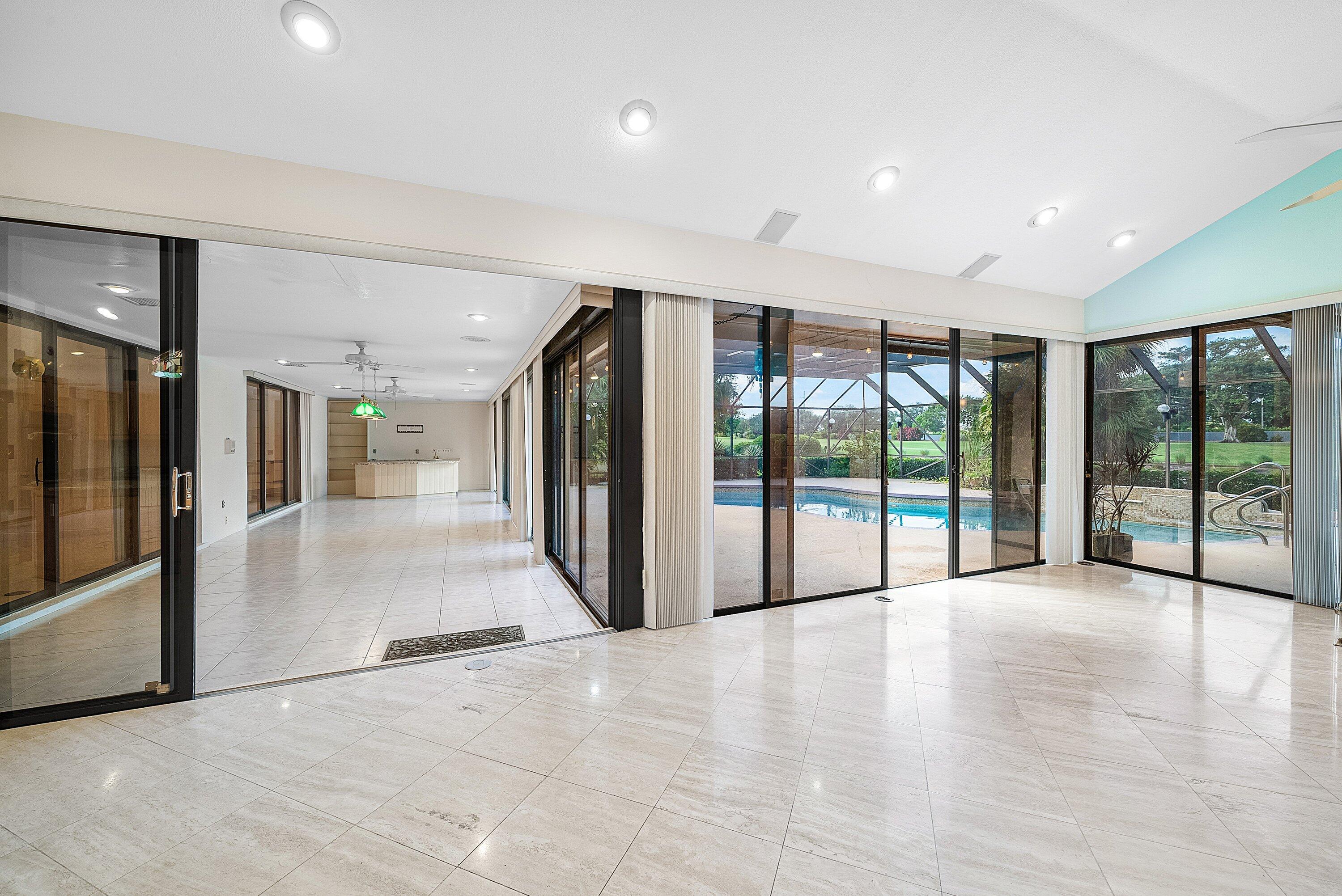4952 Bocaire Boulevard Boca Raton, FL 33487 - Photo 18 of 61 a view of an entryway with floor to ceiling window and an empty room