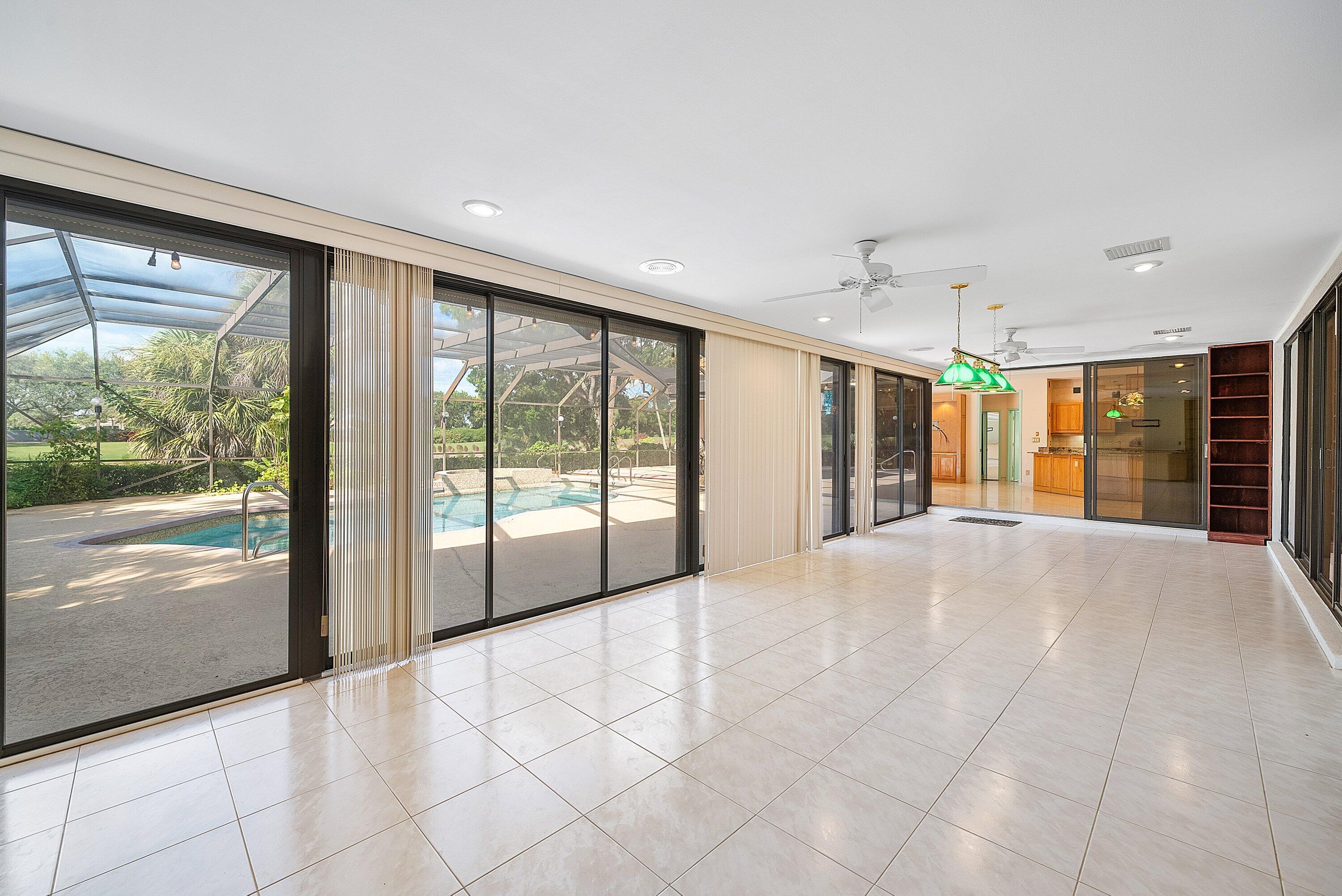 4952 Bocaire Boulevard Boca Raton, FL 33487 - Photo 25 of 61 a view of an empty room with a sliding door