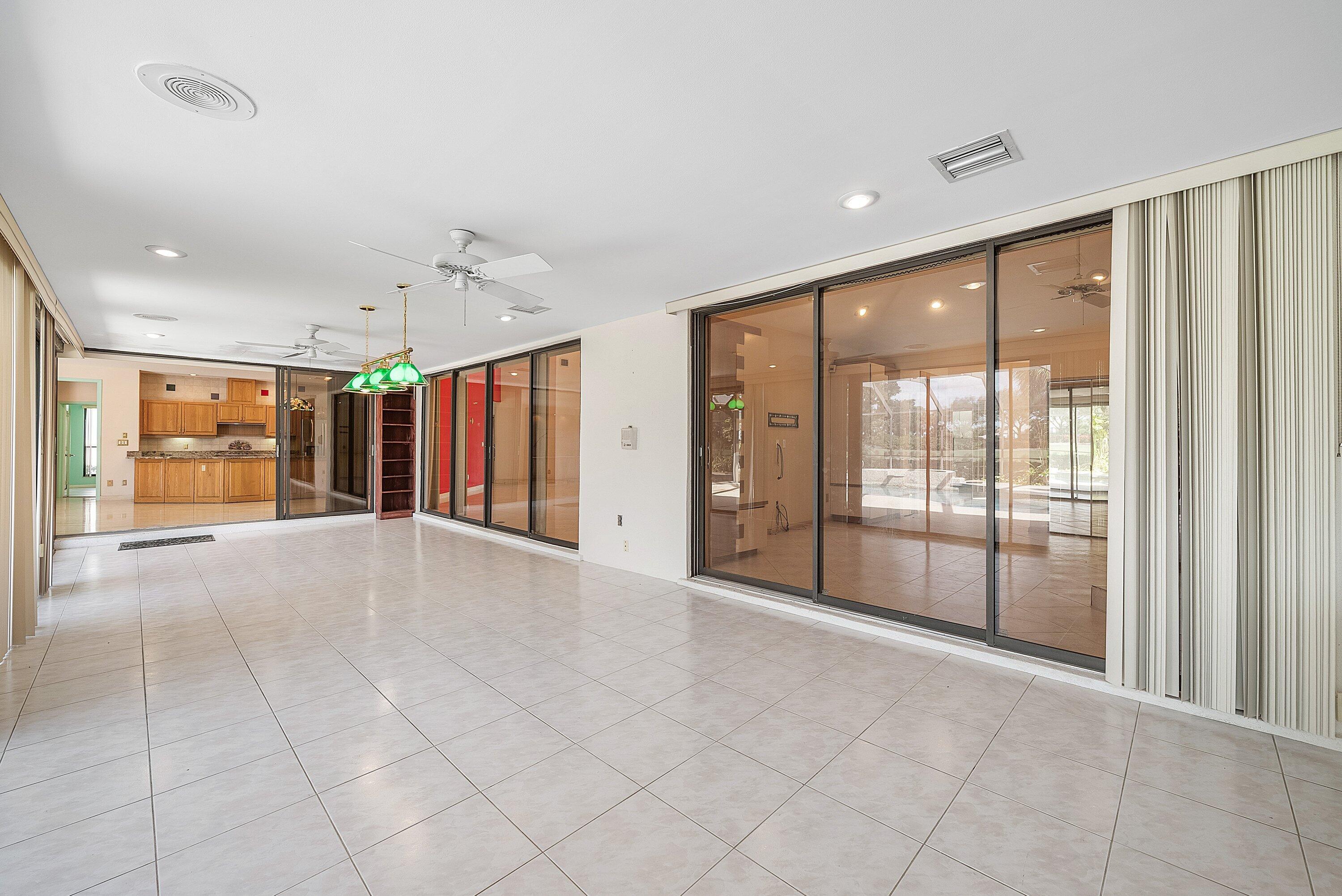 4952 Bocaire Boulevard Boca Raton, FL 33487 - Photo 26 of 61 a view of an empty room with a sliding door