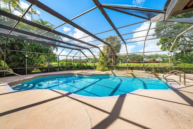 a view of swimming pool with a yard