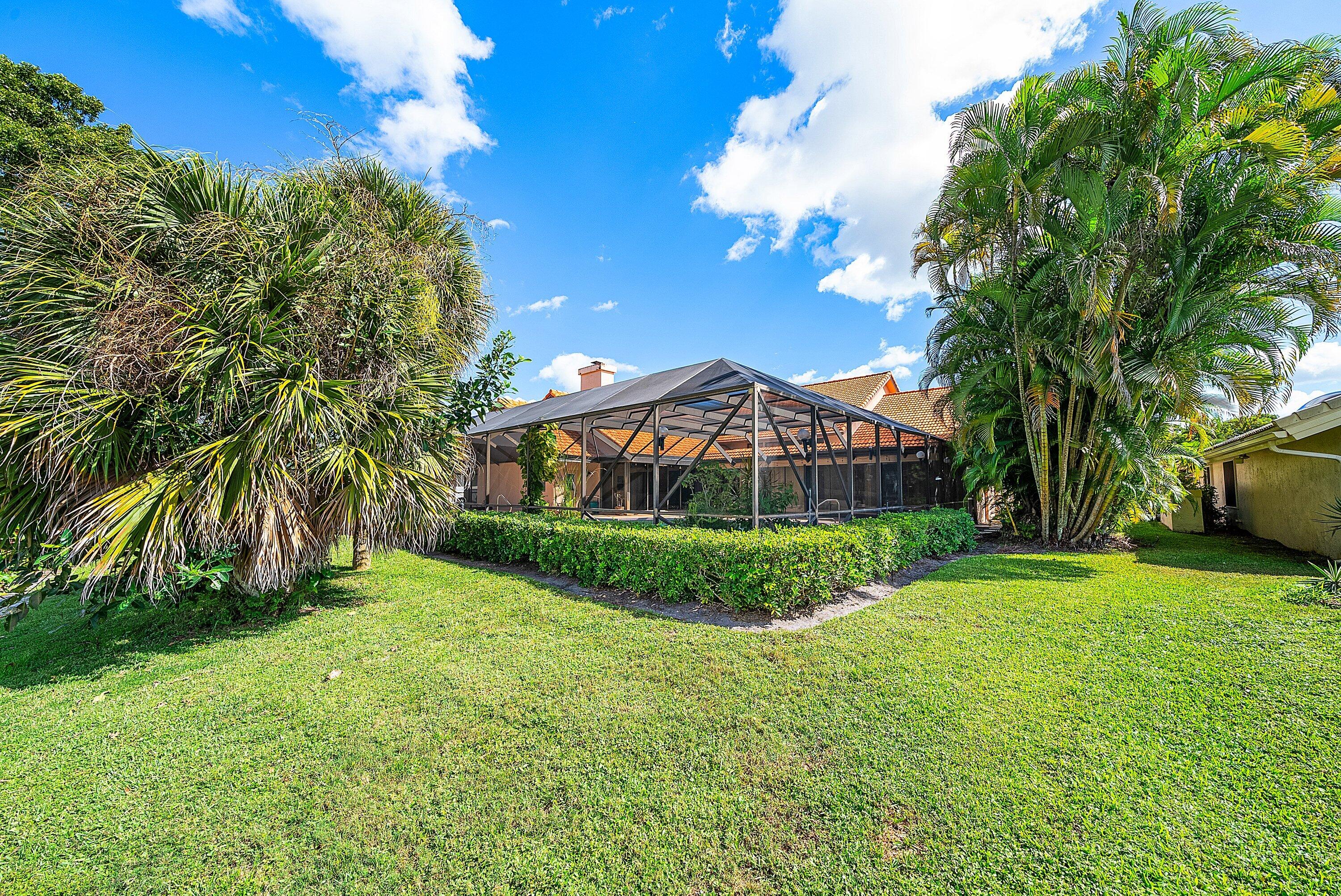 4952 Bocaire Boulevard Boca Raton, FL 33487 - Photo 37 of 61 a view of a garden in front of a house
