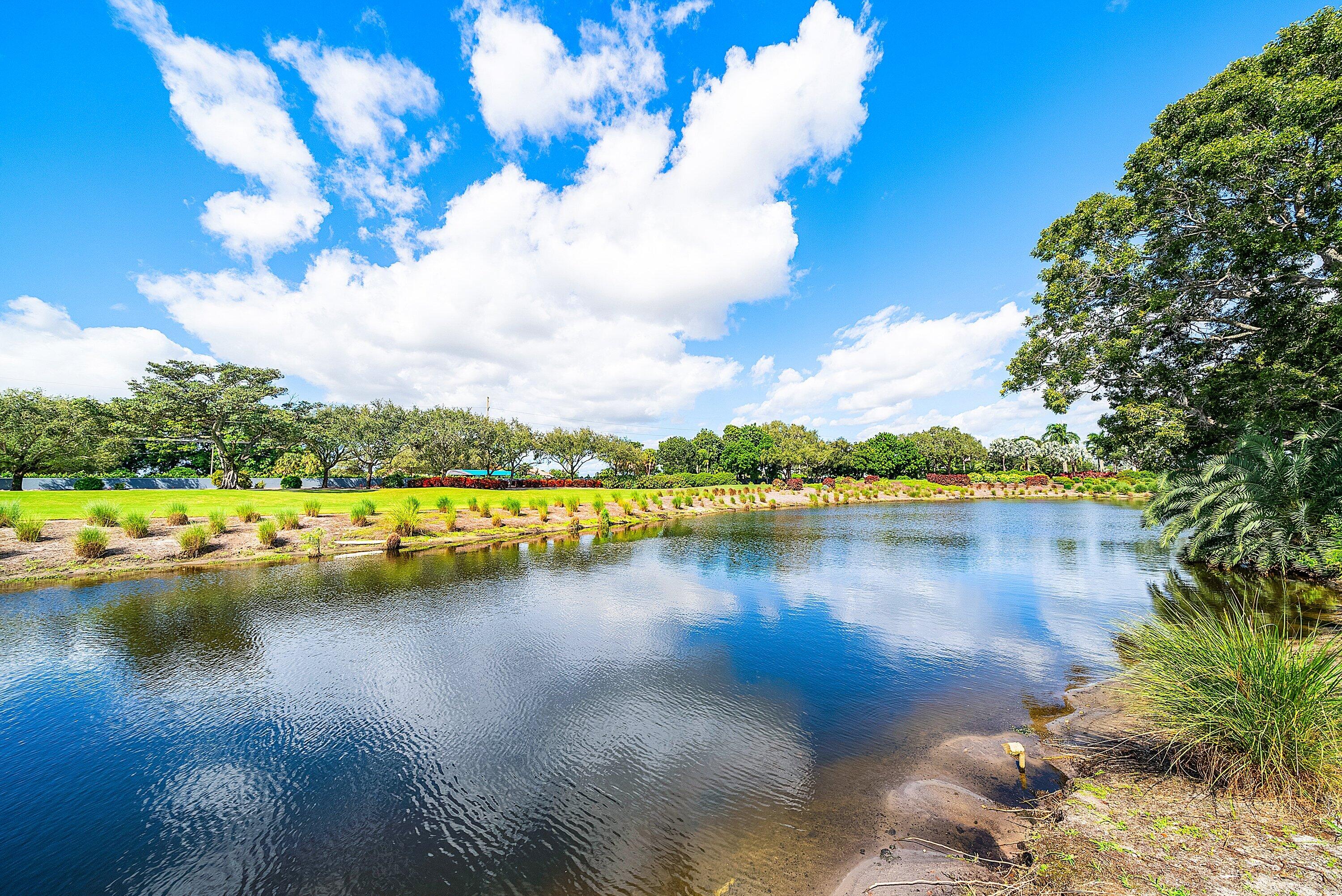 4952 Bocaire Boulevard Boca Raton, FL 33487 - Photo 38 of 61 a view of a lake with houses in the back