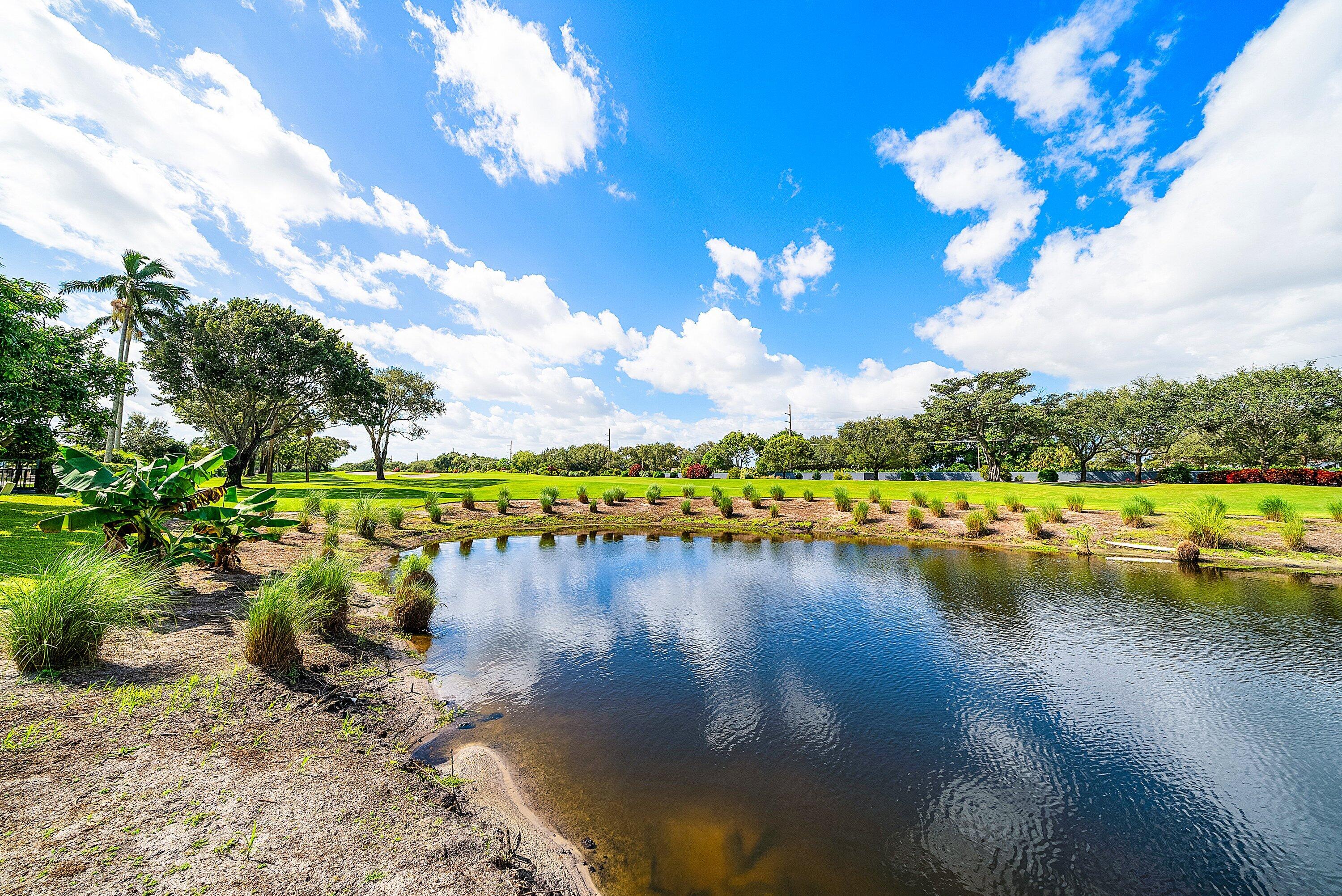 4952 Bocaire Boulevard Boca Raton, FL 33487 - Photo 4 of 61 a view of a lake with houses in the back