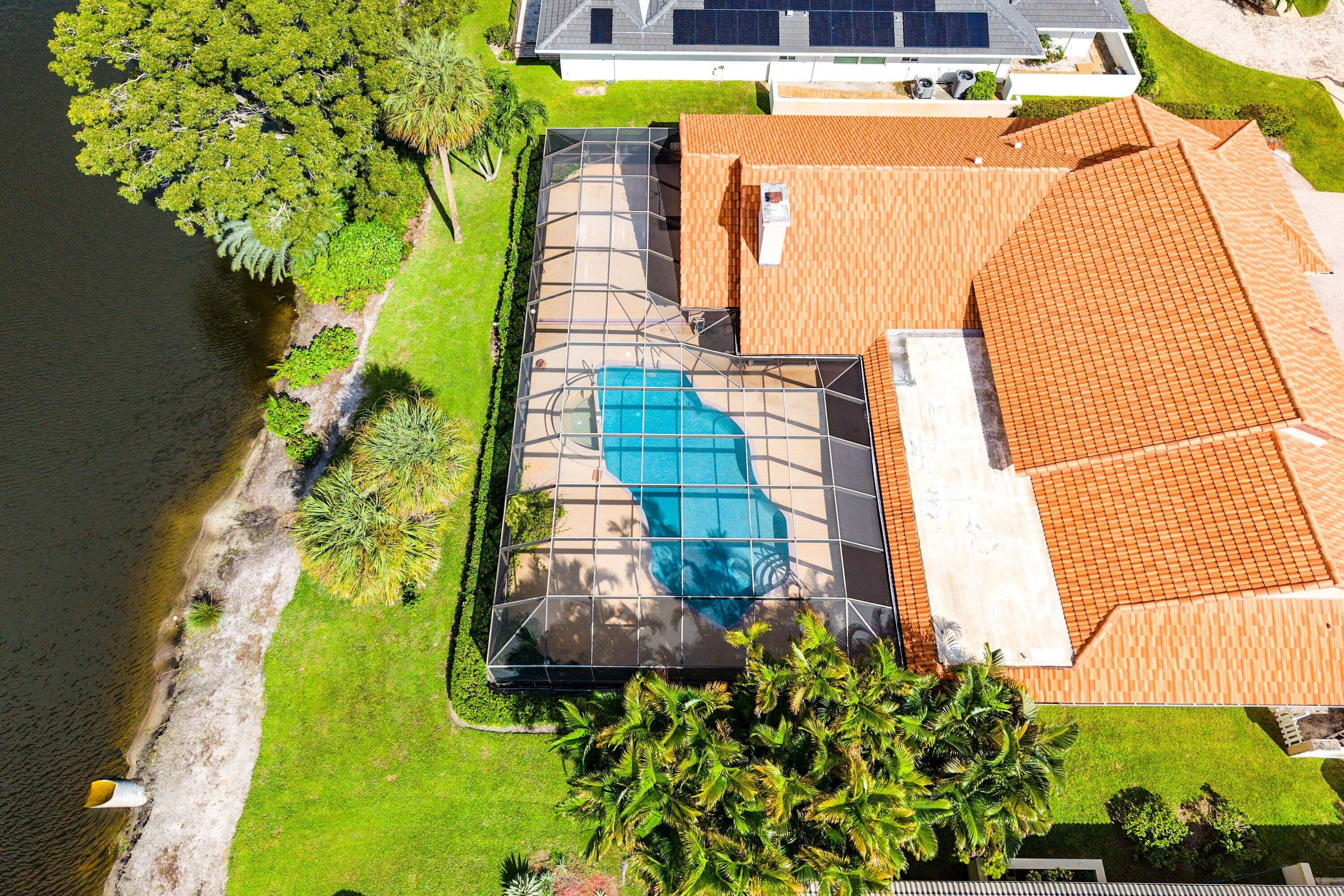 4952 Bocaire Boulevard Boca Raton, FL 33487 - Photo 41 of 61 a view of swimming pool with a yard