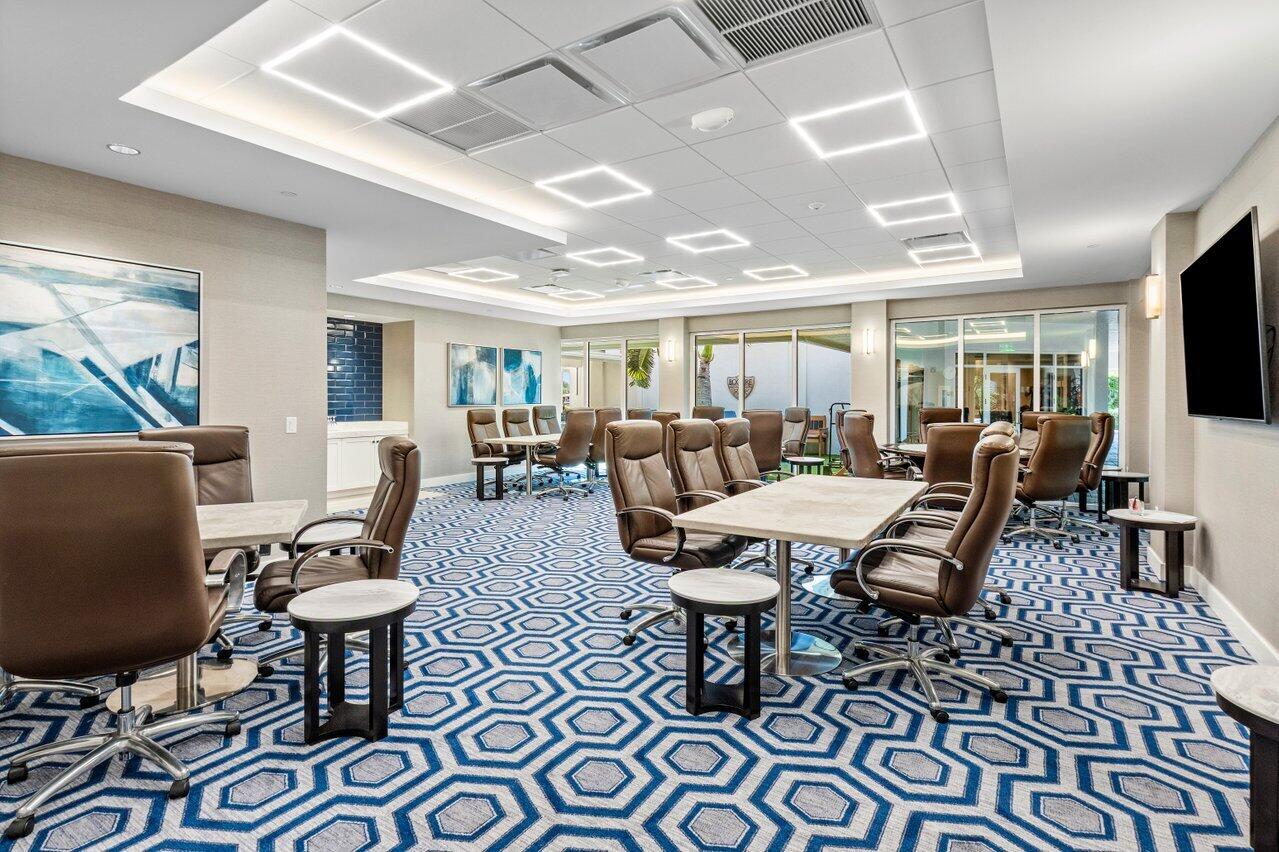 4952 Bocaire Boulevard Boca Raton, FL 33487 - Photo 53 of 61 a living room with furniture and a flat screen tv