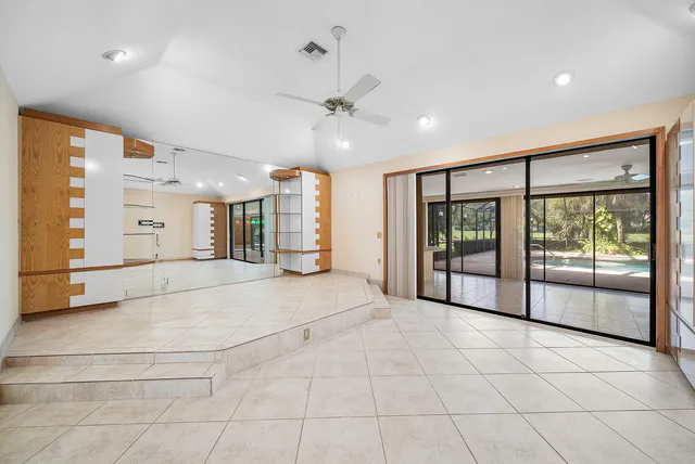 a kitchen with stainless steel appliances granite countertop a refrigerator and a stove