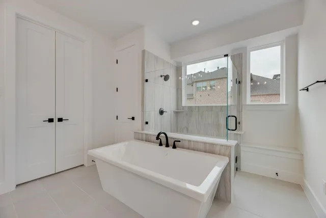 a bathroom with a bathtub and a sink