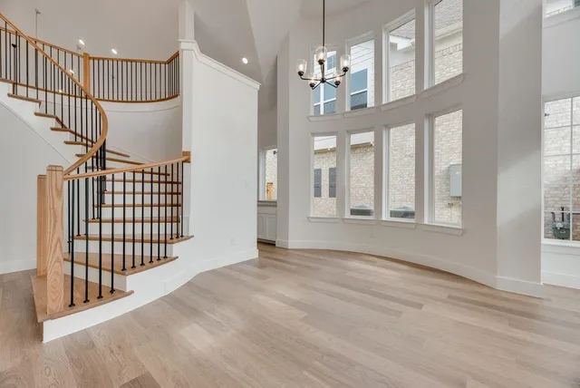 a view of an entryway with wooden floor