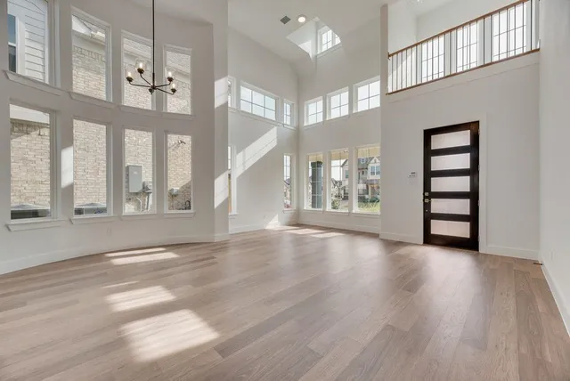 a view of an entryway with wooden floor