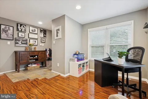 a room that has a bed and a desk in it