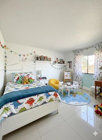 a view of a swimming pool with a garden and seating area