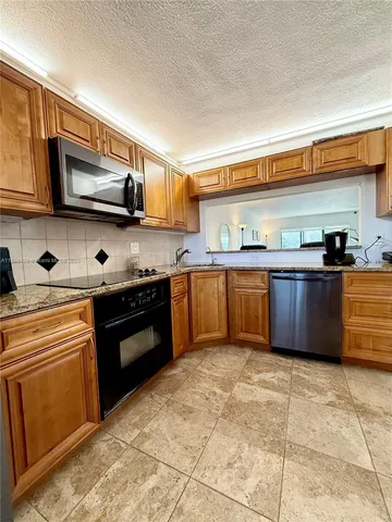 a view of a livingroom with furniture and window