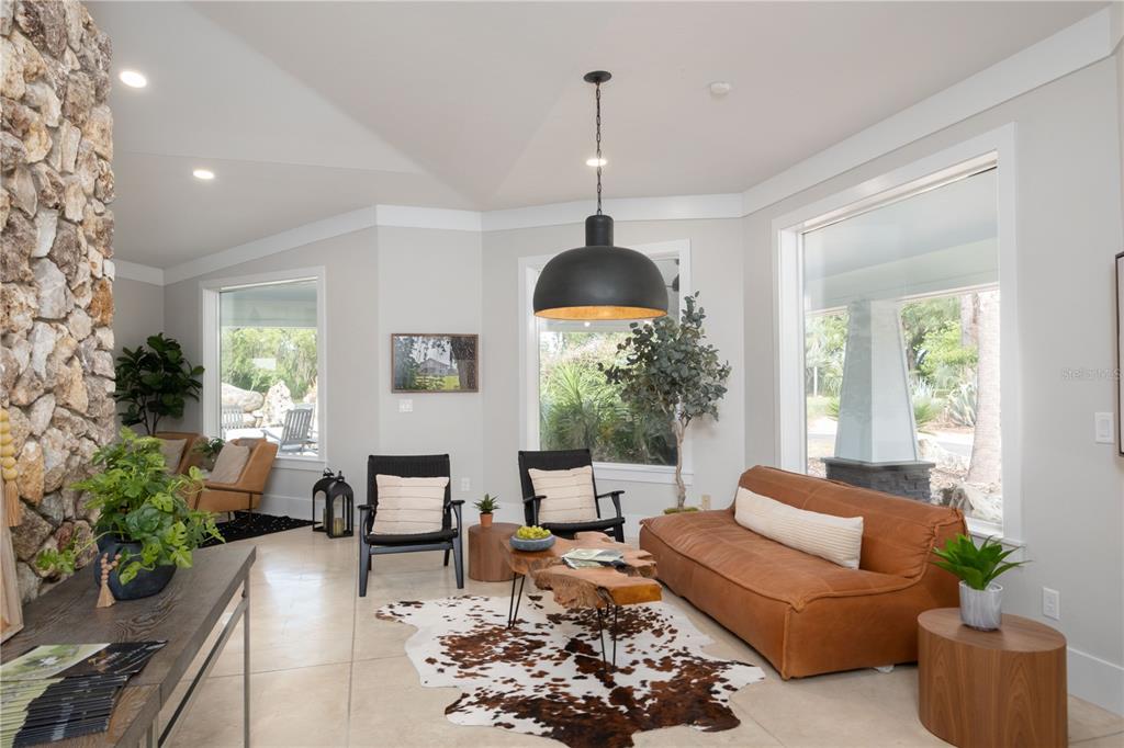 39 Southwest 124th Way Archer, FL 32618 - Photo 12 of 15 a living room with furniture and a chandelier