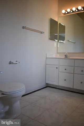 a bathroom with a toilet and a sink