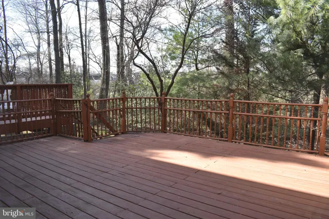 a view of a balcony with wooden floor