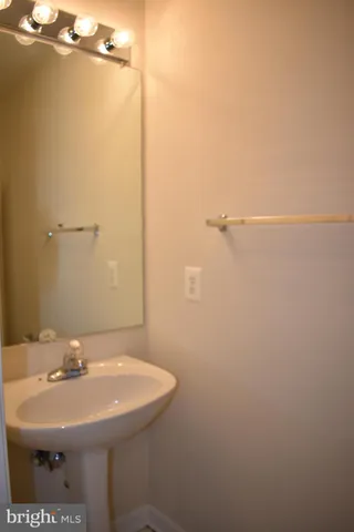 a bathroom with a sink and mirror