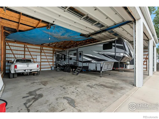 a view of a patio with a table and chairs