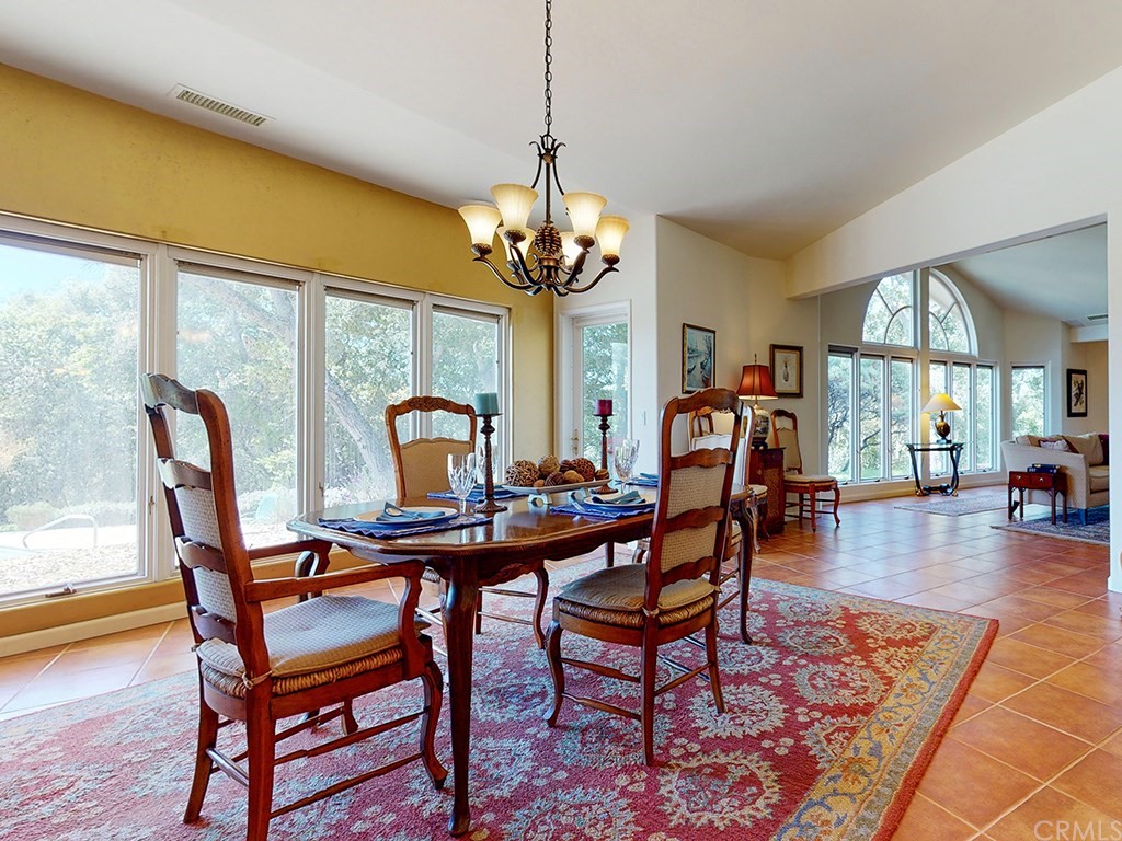 8800 Vineyard Drive Paso Robles, CA 93446 - Photo 12 of 74 a view of a dining room with furniture window and wooden floor