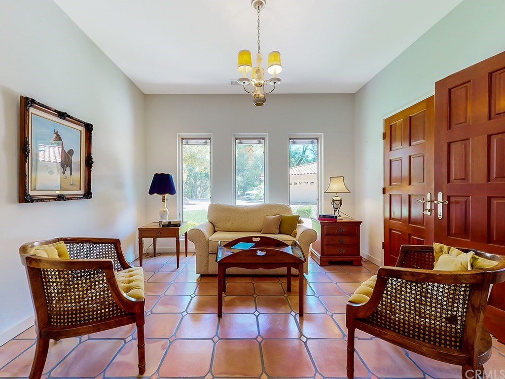 8800 Vineyard Drive Paso Robles, CA 93446 - Photo 13 of 74 a living room with furniture a chandelier and a rug