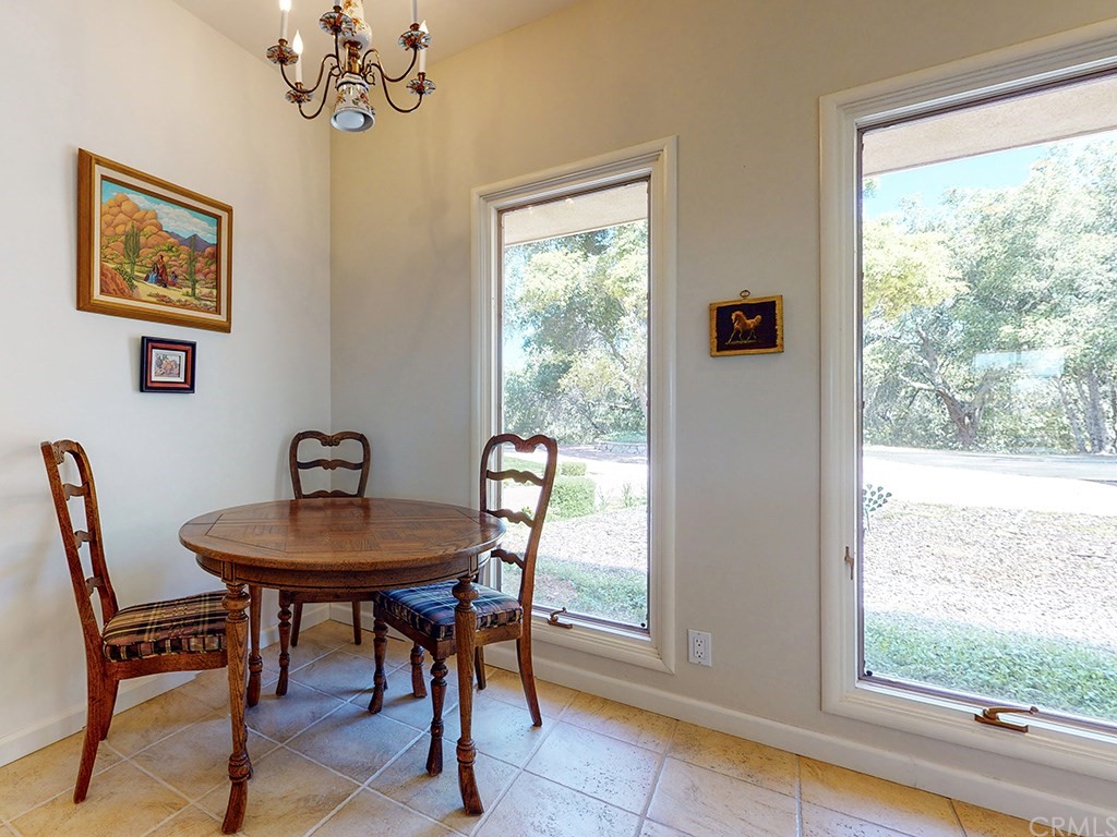 8800 Vineyard Drive Paso Robles, CA 93446 - Photo 18 of 74 a view of a dining room with furniture window and outside view