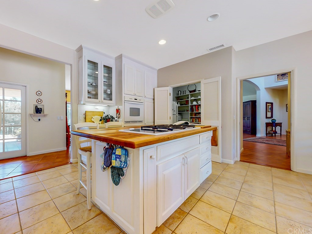 8800 Vineyard Drive Paso Robles, CA 93446 - Photo 19 of 74 a large kitchen with stainless steel appliances granite countertop a large counter top and a stove