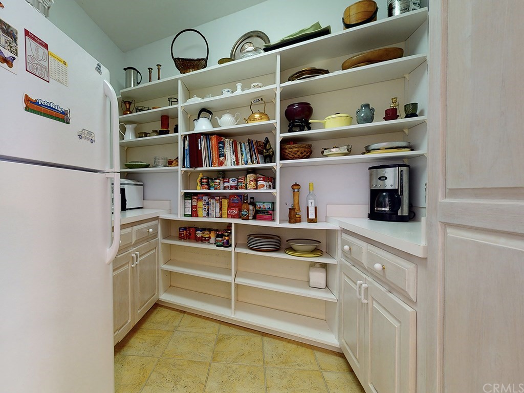8800 Vineyard Drive Paso Robles, CA 93446 - Photo 22 of 74 a view of kitchen cabinets with food items with white countertops
