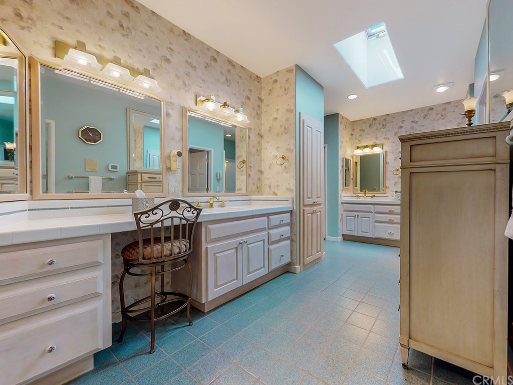 8800 Vineyard Drive Paso Robles, CA 93446 - Photo 28 of 74 a spacious bathroom with a granite countertop sink mirror and a