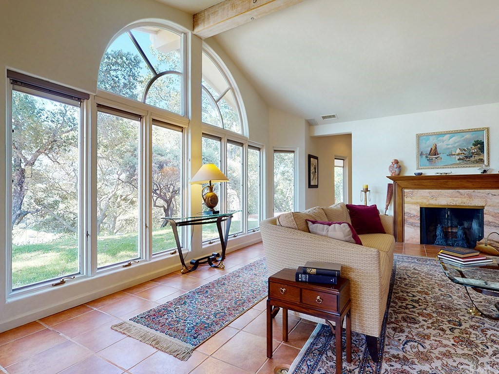 8800 Vineyard Drive Paso Robles, CA 93446 - Photo 7 of 74 a living room with furniture a fireplace and a large window