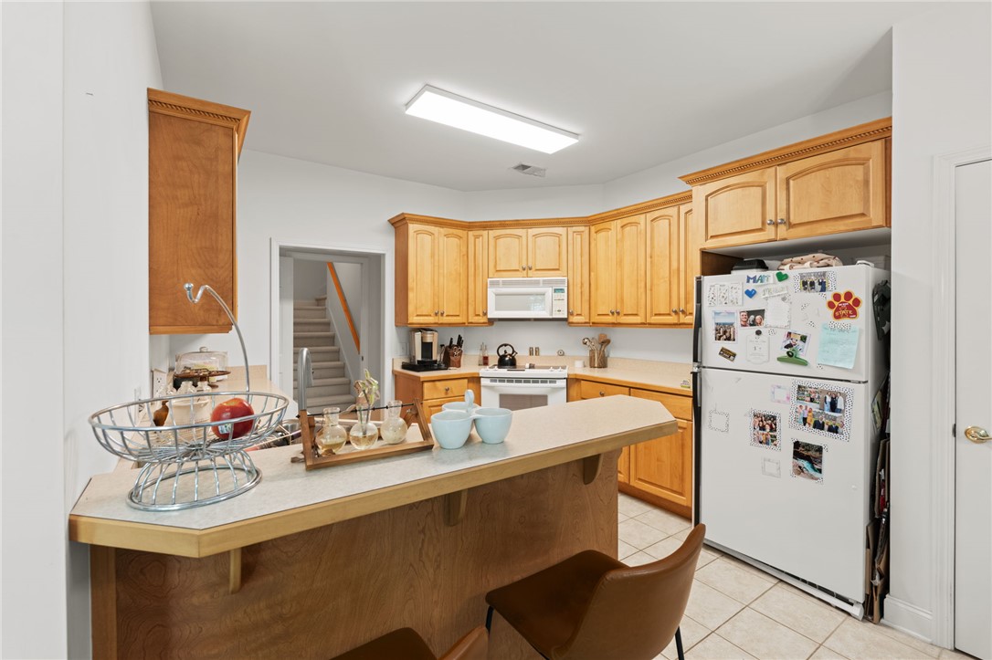 108 Winterbrook Circle Seneca, SC 29678 - Photo 15 of 40 A well-appointed kitchen offers ample cabinetry and an integrated breakfast bar.