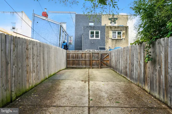 a backyard of a house with a garage