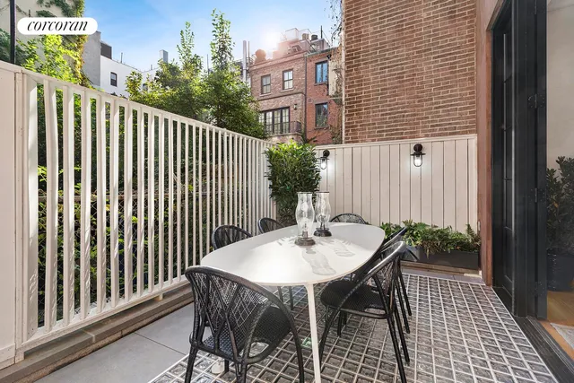 a kitchen with stainless steel appliances kitchen island granite countertop a stove and cabinets
