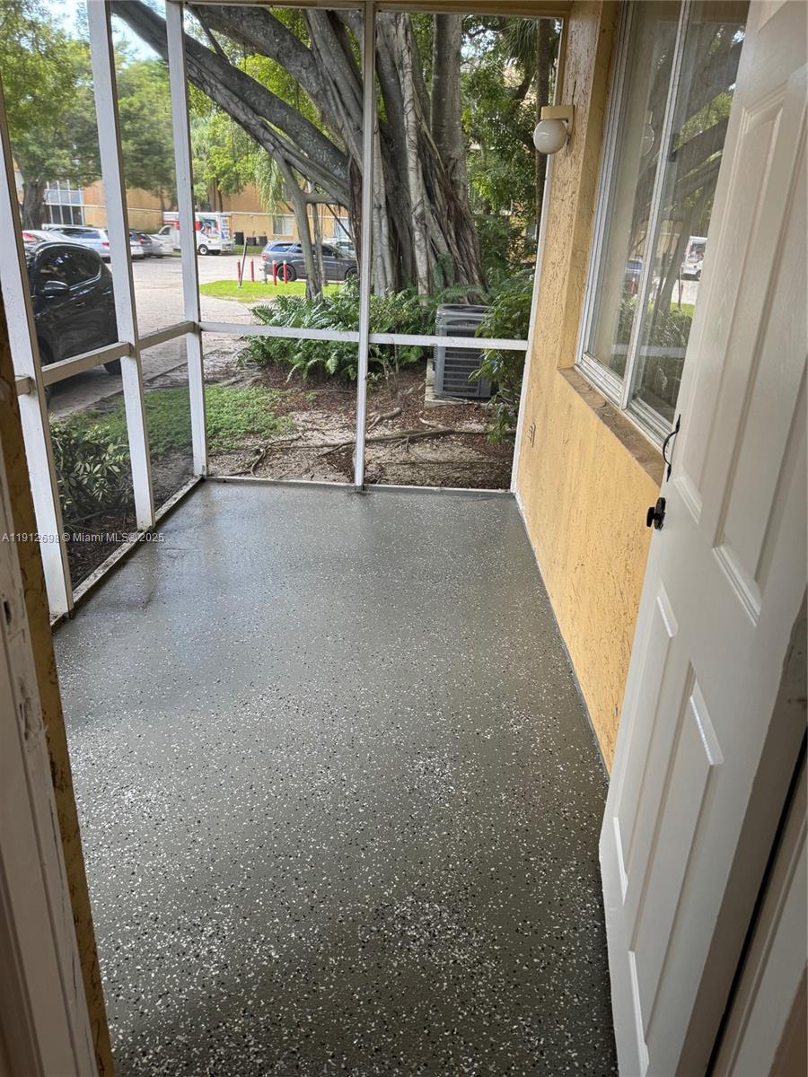 4025 West McNab Road, Unit E109 Pompano Beach, FL 33069 - Photo 9 of 13 a view of outdoor space with porch