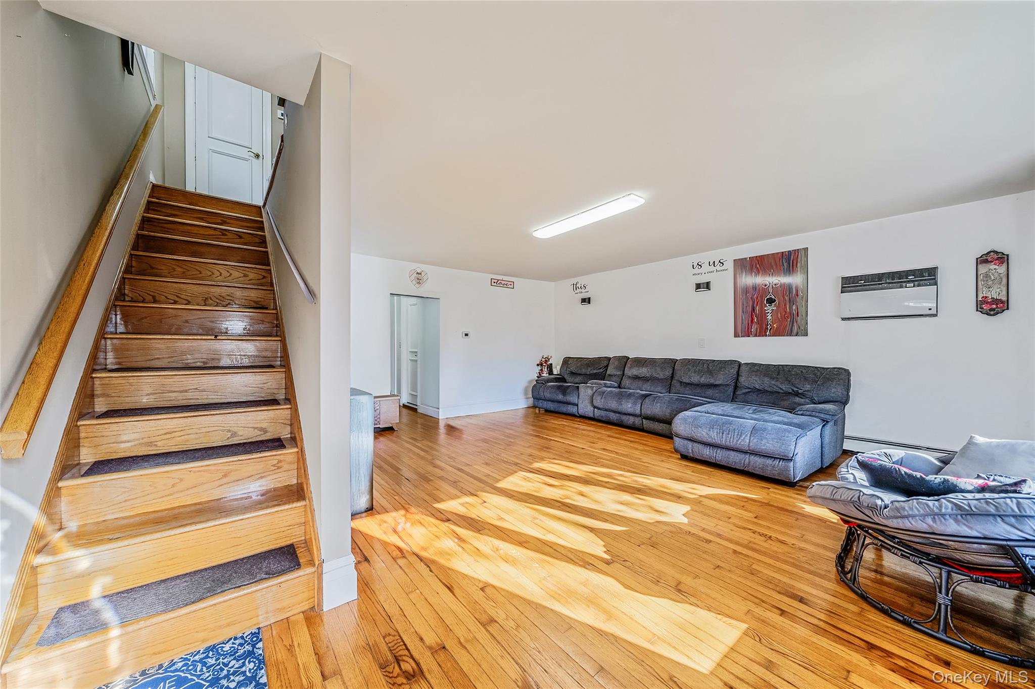 267 Dogwood Road West Mastic Beach, NY 11951 - Photo 16 of 30 a living room with furniture and a wooden floor
